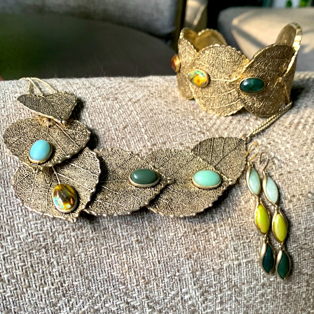 Kenneth Cole REACTION Jewelry set natural stones in muted gold leaves.